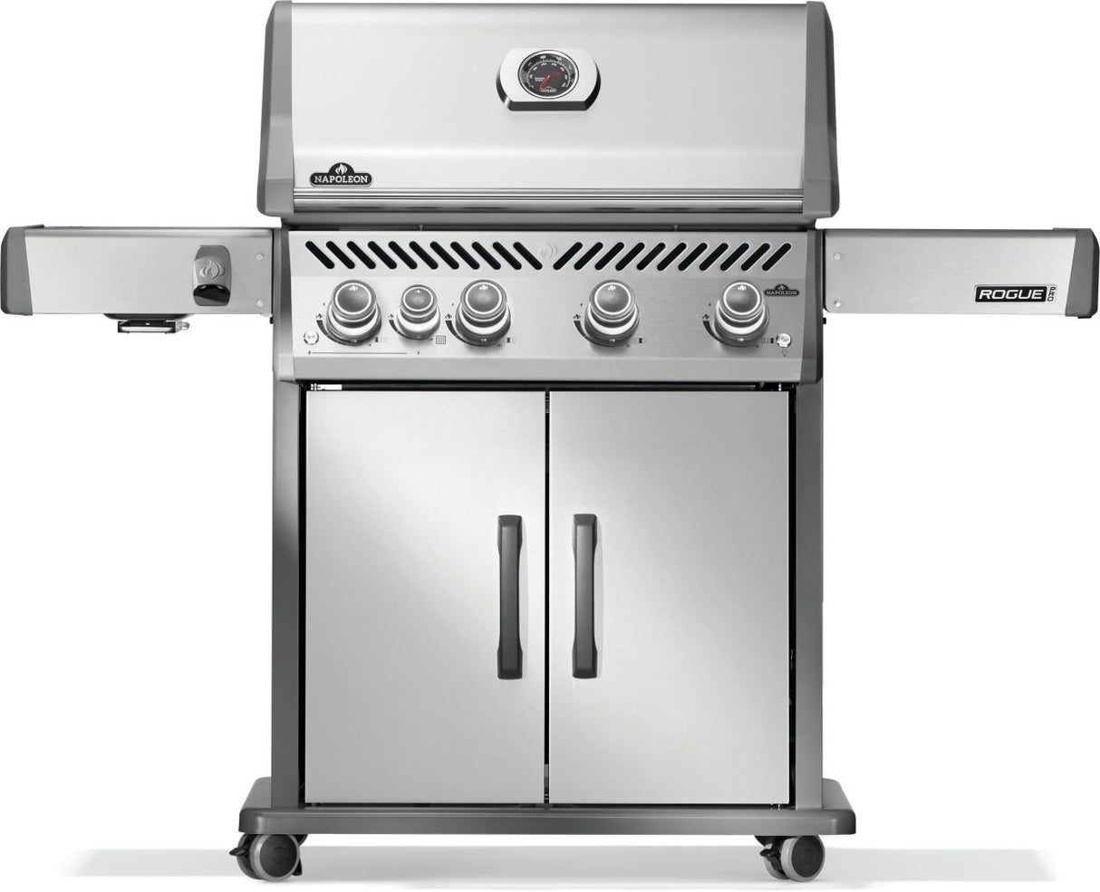Silver and gray Napoleon grill. There is a built-in thermometer on the lid, there are two shelves outstretched, five buttons and a cabinet that opens up underneath. This is the front view.