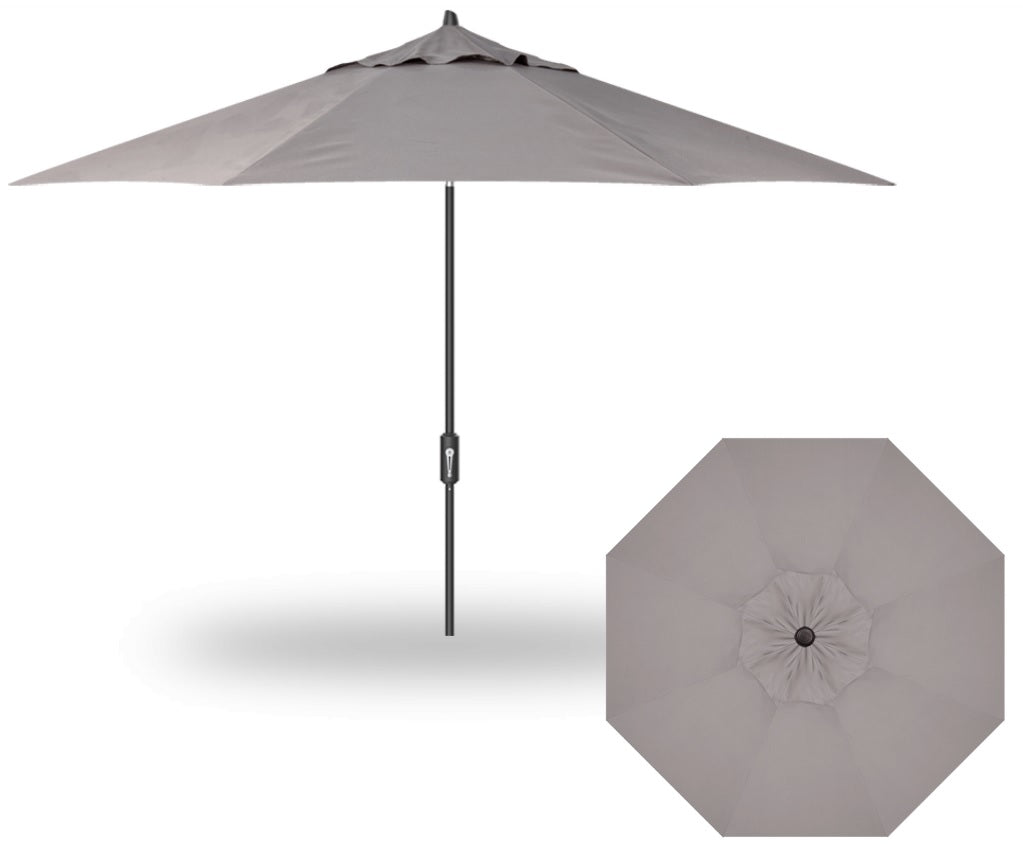 A tan colored market umbrella with a black pole.
