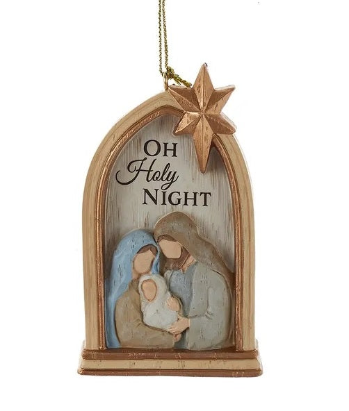 This image shows a window arch shaped ornament with Mary and Joseph holding baby Jesus. There's a star at the top and it reads "OH HOLY NIGHT."