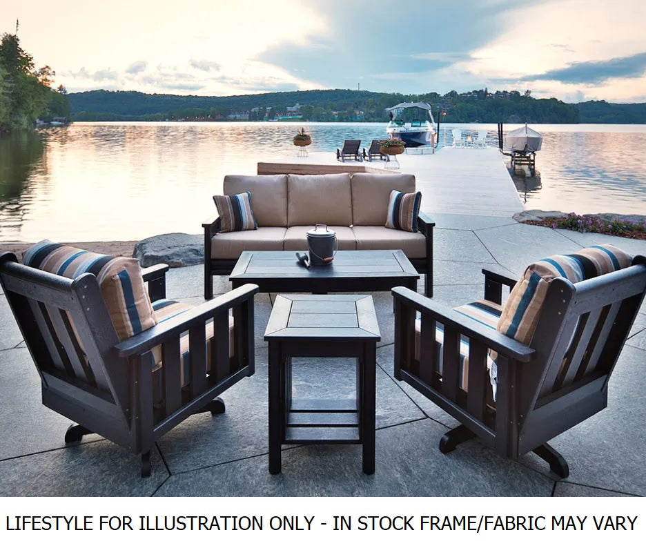 Resin patio furniture on a dock near a large body of water
