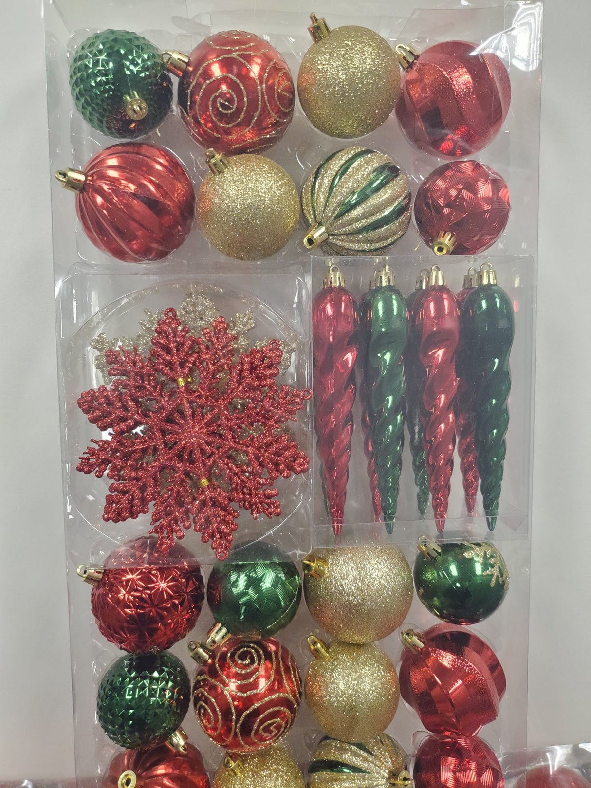 Set of 36 ornaments. One set features all Red ornaments in different sizes, shapes and textures. One set features Red and Gold ornaments in different sizes, shapes and textures. One set features Red, Green and Gold ornaments in different sizes, shapes and textures.