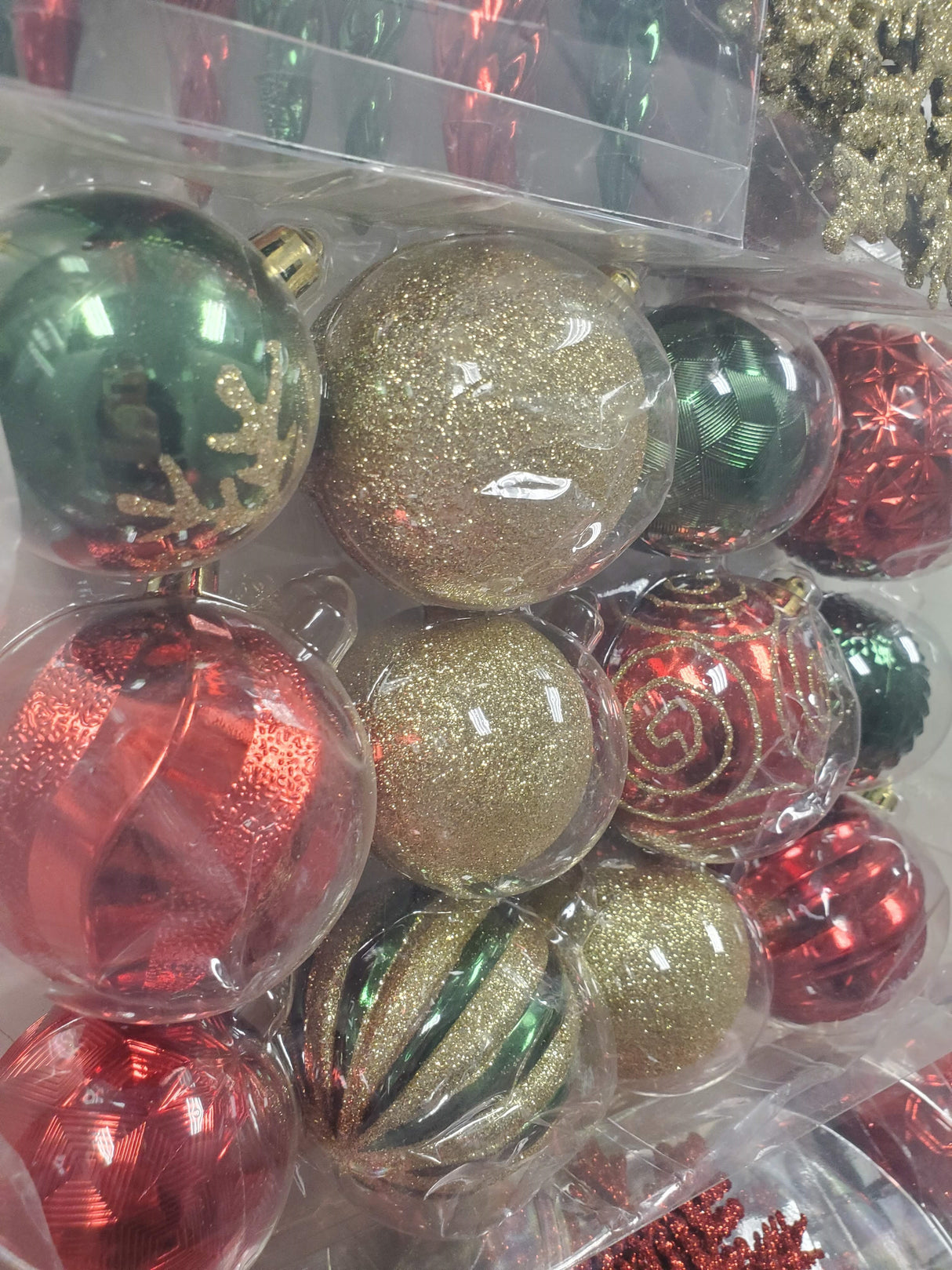 Set of 36 ornaments. One set features all Red ornaments in different sizes, shapes and textures. One set features Red and Gold ornaments in different sizes, shapes and textures. One set features Red, Green and Gold ornaments in different sizes, shapes and textures.