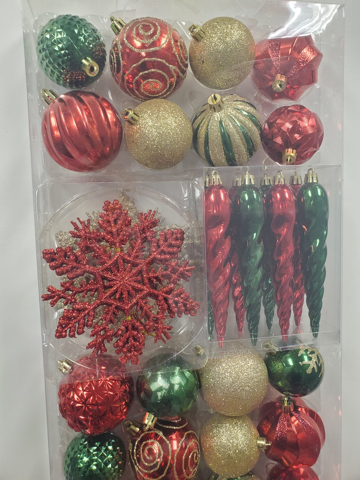 Set of 36 ornaments. One set features all Red ornaments in different sizes, shapes and textures. One set features Red and Gold ornaments in different sizes, shapes and textures. One set features Red, Green and Gold ornaments in different sizes, shapes and textures.