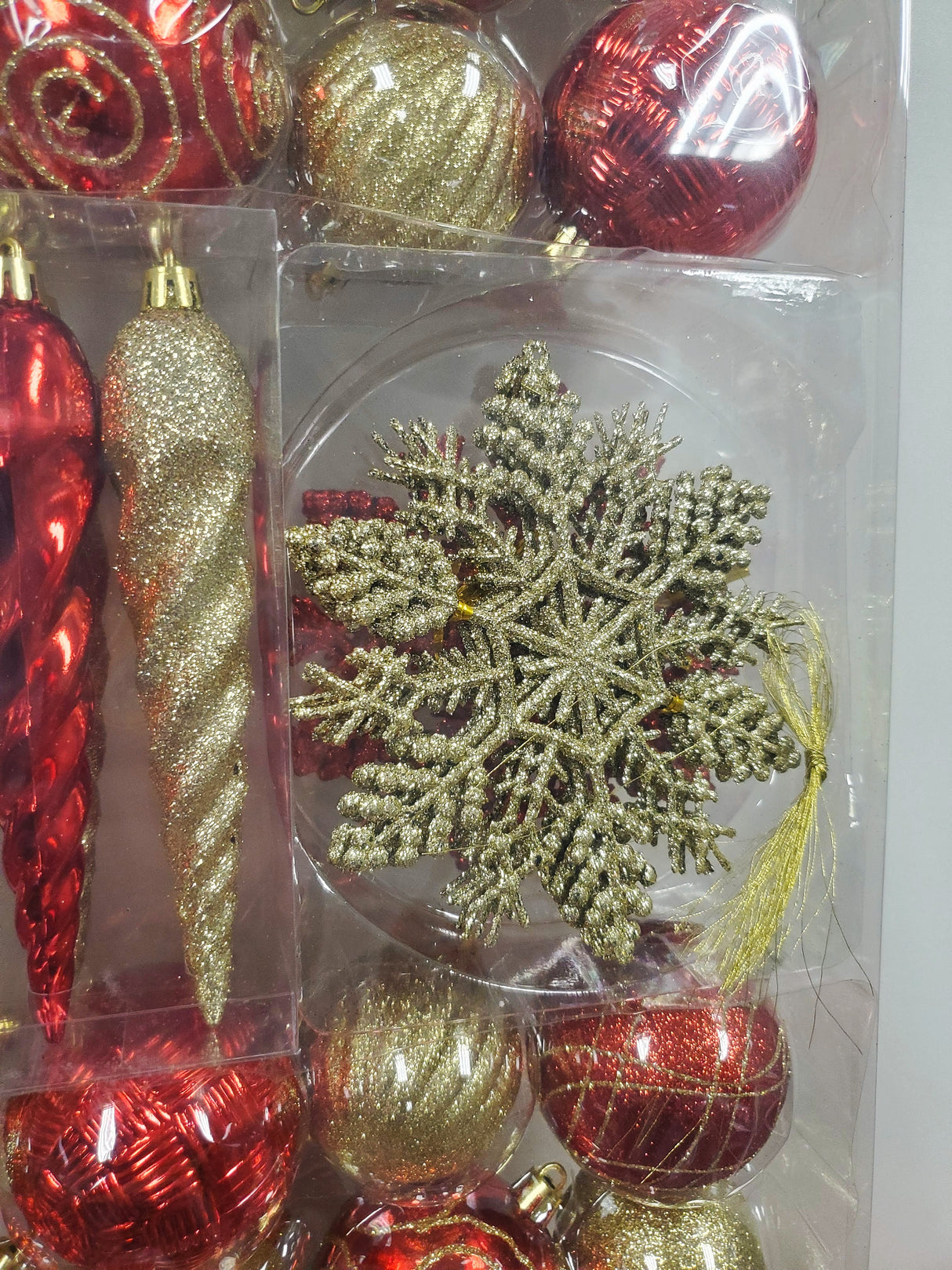 Set of 36 ornaments. One set features all Red ornaments in different sizes, shapes and textures. One set features Red and Gold ornaments in different sizes, shapes and textures. One set features Red, Green and Gold ornaments in different sizes, shapes and textures.