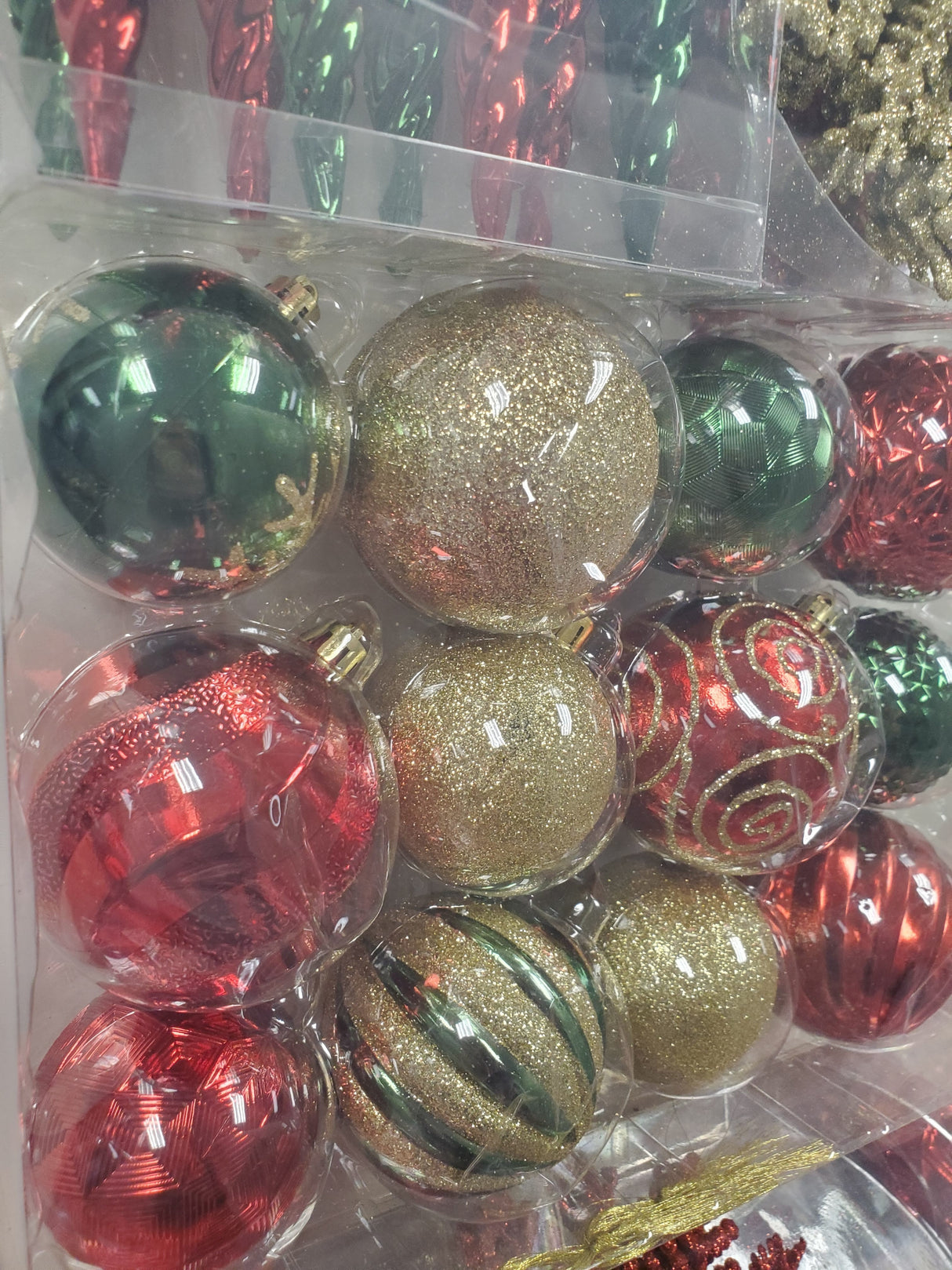 Set of 36 ornaments. One set features all Red ornaments in different sizes, shapes and textures. One set features Red and Gold ornaments in different sizes, shapes and textures. One set features Red, Green and Gold ornaments in different sizes, shapes and textures.