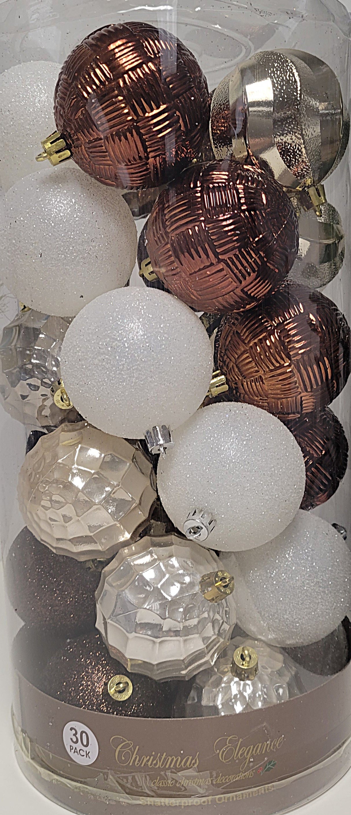 70MM ornaments feature different designs/textures. Some of the ornaments are shiny brown. Some of the ornaments are covered in white glitter.
Some of the ornaments are a shiny light gold
