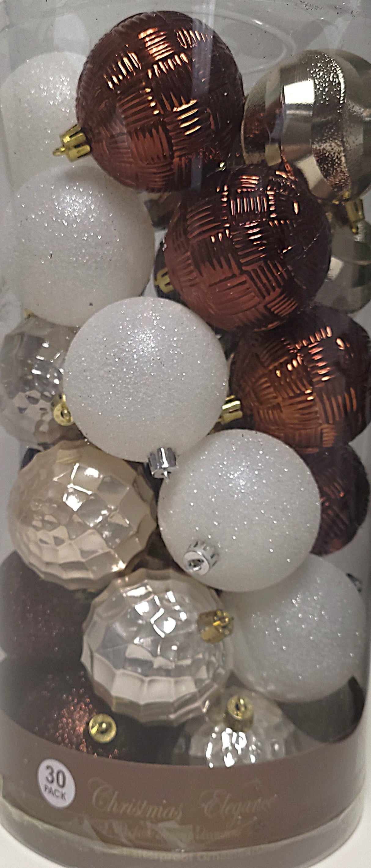 70MM ornaments feature different designs/textures. Some of the ornaments are shiny brown. Some of the ornaments are covered in white glitter.