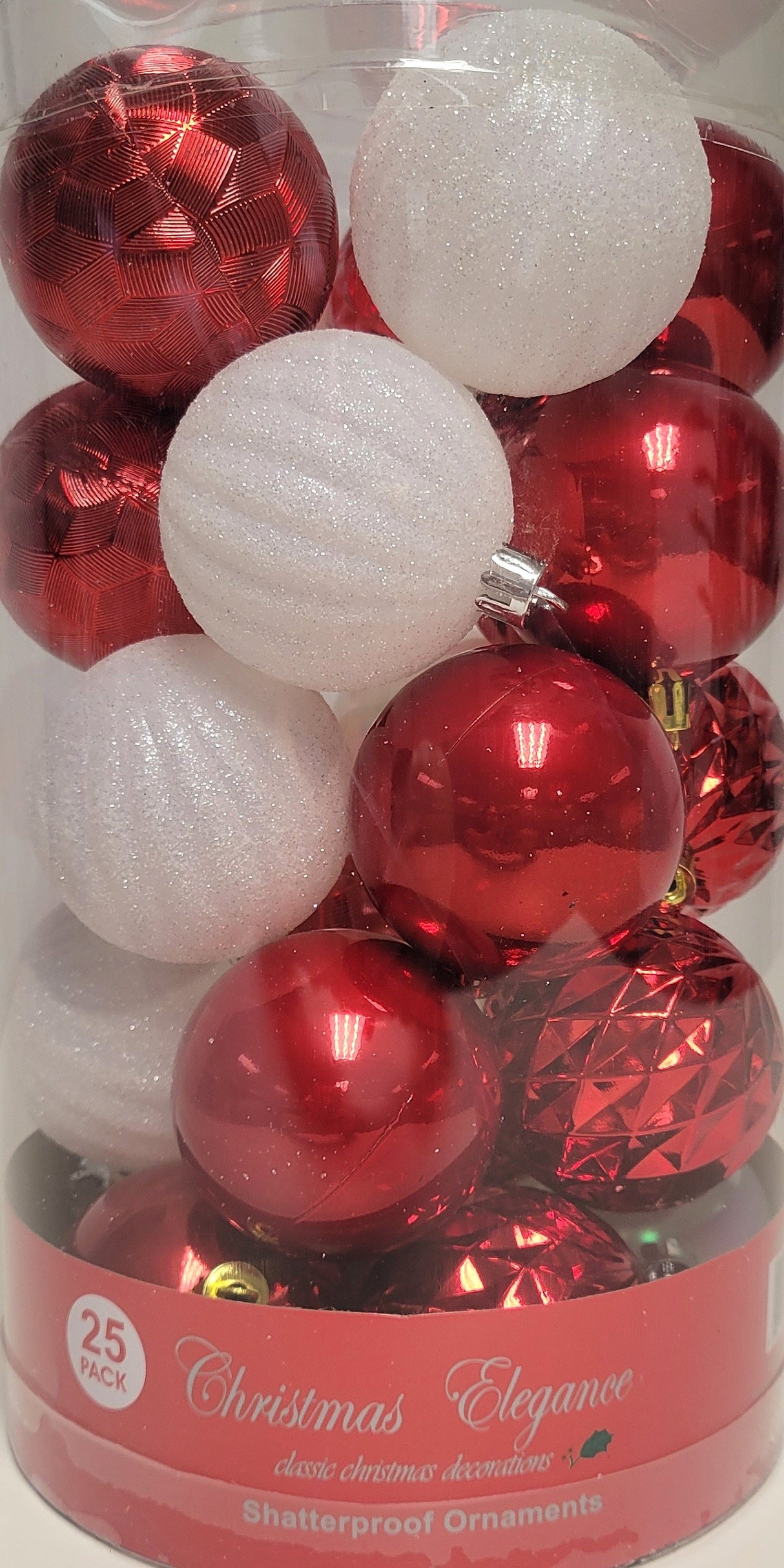 60MM ornaments feature different designs/textures. Some of the ornaments are shiny red. Some of the ornaments are covered in white glitter.