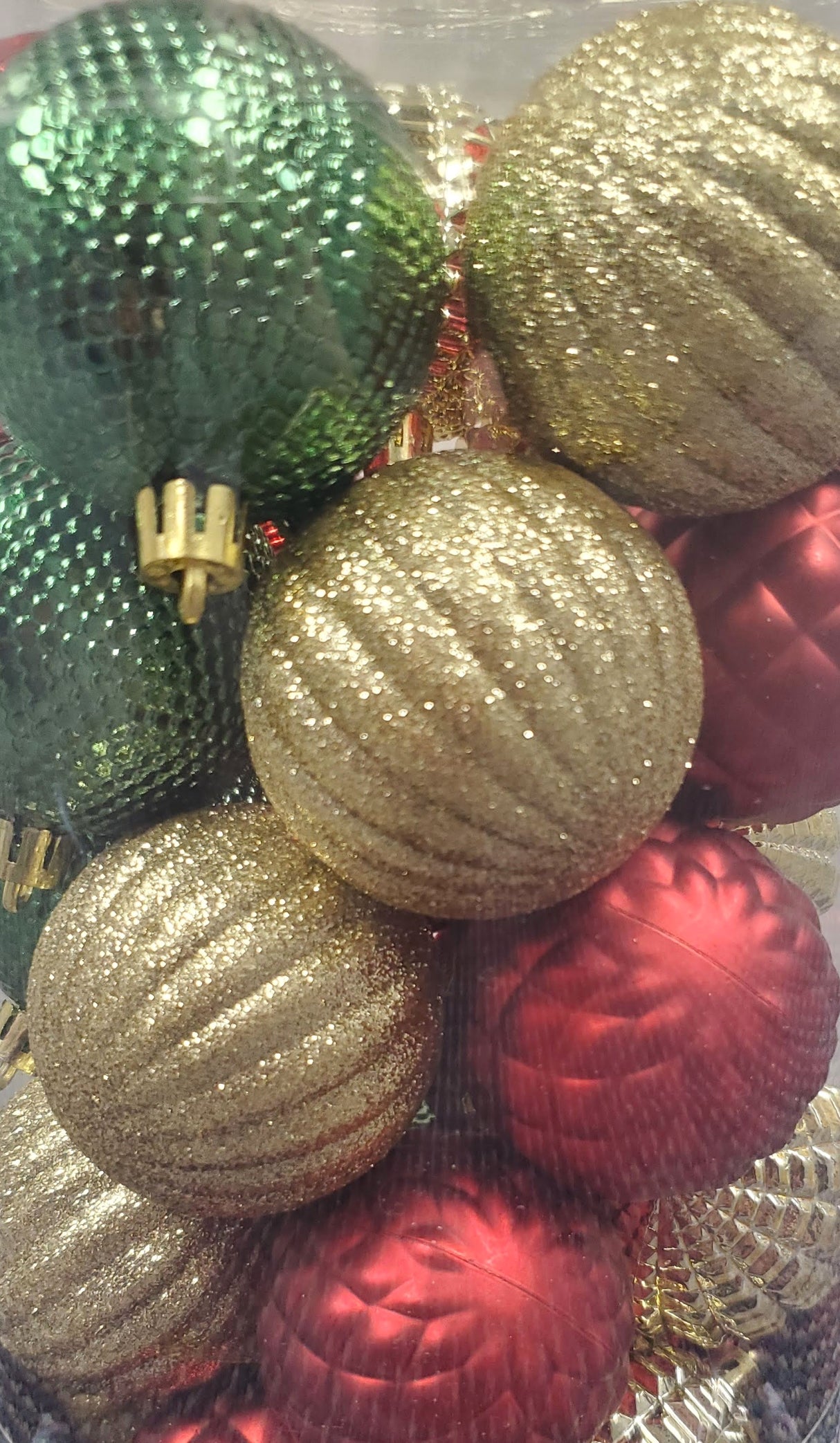 Set of 25 different ornaments. One set of ornaments are all Red in different designs and textures. One set of ornaments are Red and Gold in different designs and textures. One set of ornaments are Red, Gold and Green in different designs and textures.