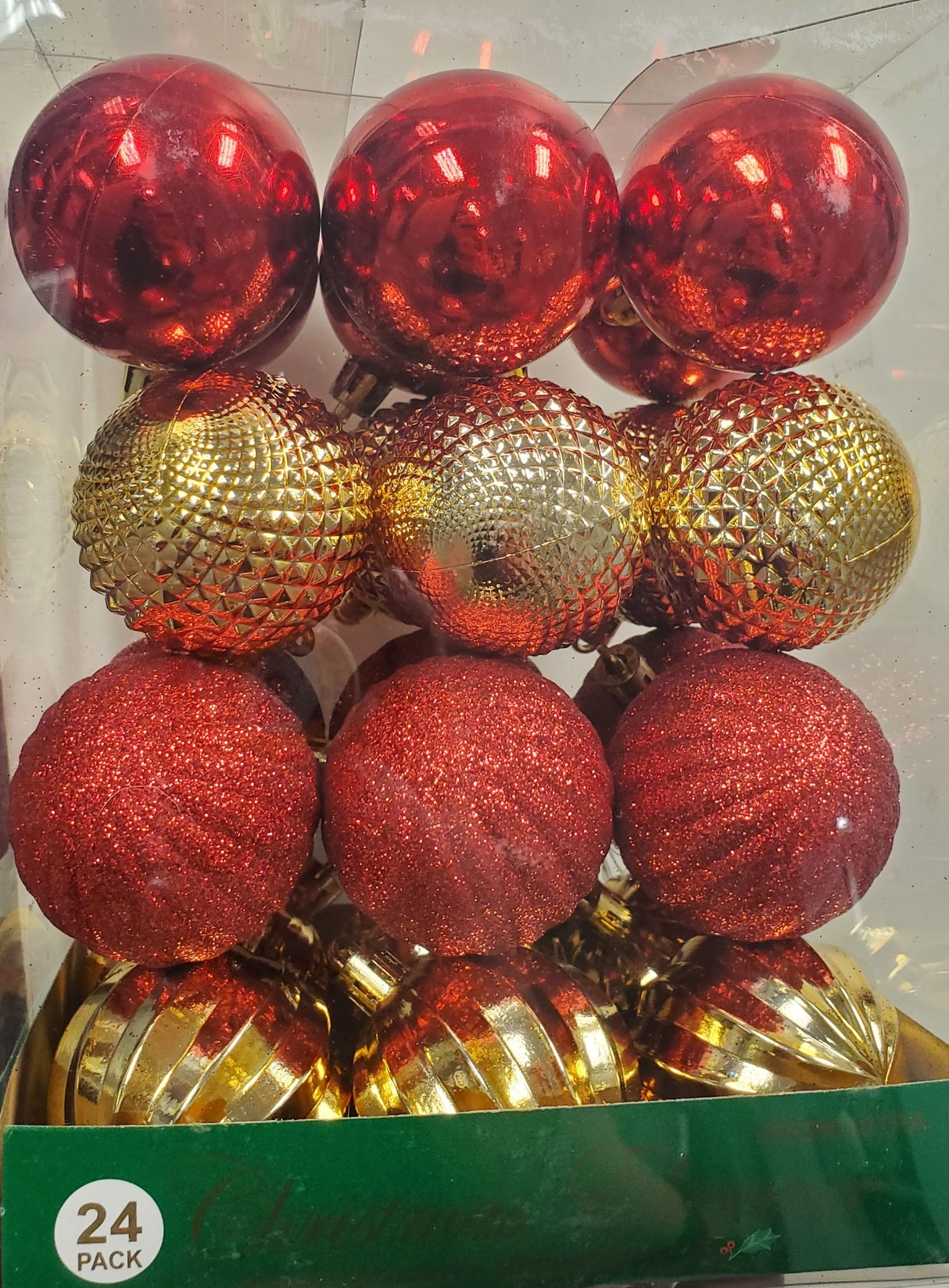 Set of 24 ornaments. This is a pack of red and gold ornaments in different textures. Red shiny ornaments, red glittery ornaments, gold shiny ornaments in different textures.
