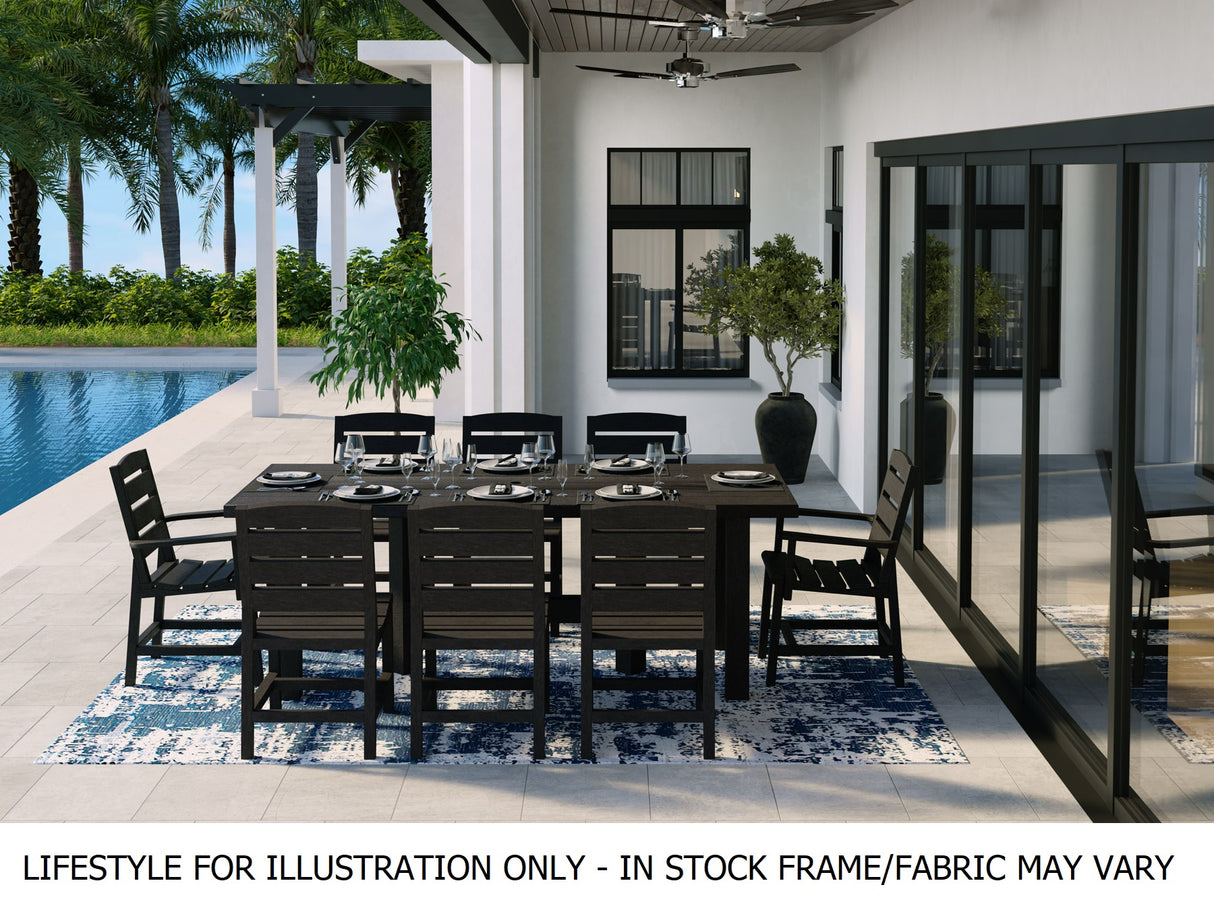Resin patio dining set on a modern, outdoor patio next to a large in-ground pool