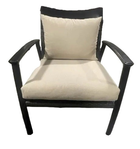 An armchair made up of aluminum and wicker