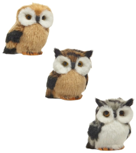 Fluffy ornament shaped like an owl. One is tan, one is brown and one is grey.