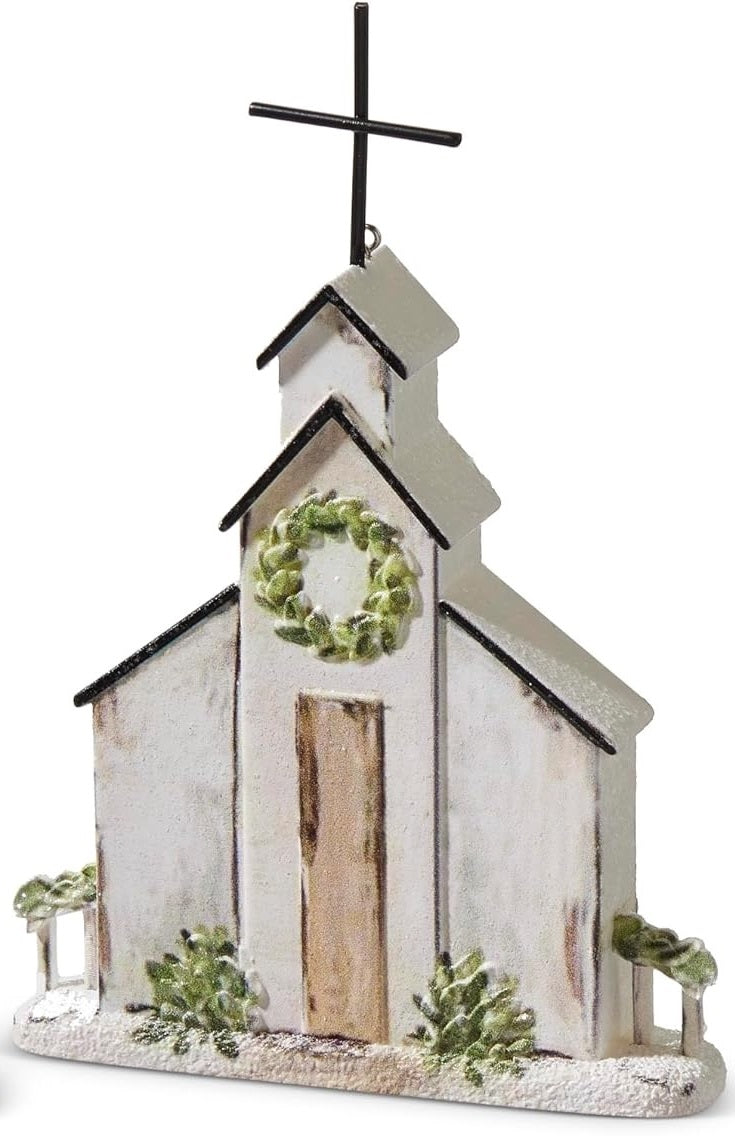 Ornament shaped like a church. One church features a wreath near the steeple. One church features a garland near the steeple.