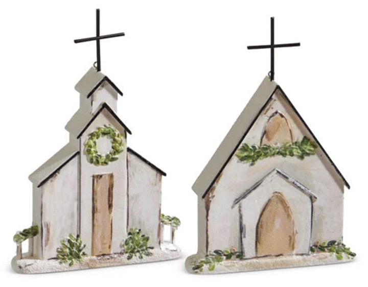 Ornament shaped like a church. One church features a wreath near the steeple. One church features a garland near the steeple.