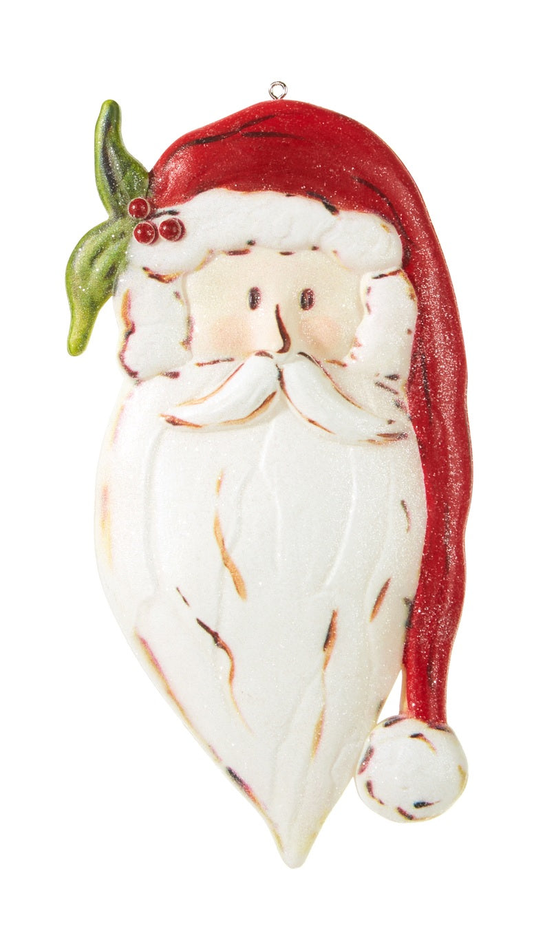 Santa Claus head ornament. One is wearing a red Santa hat and one is wearing a green Santa hat.