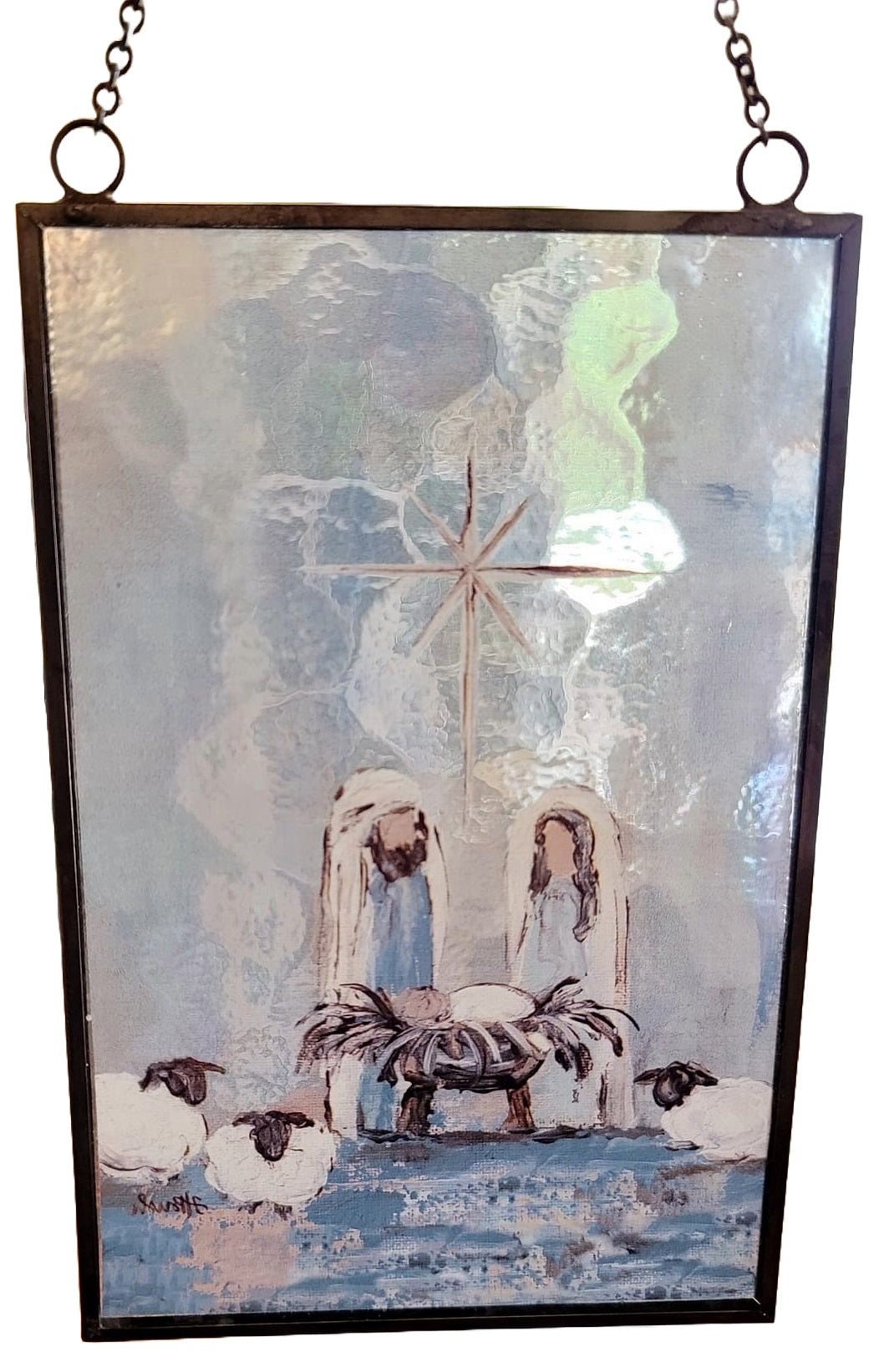 Christmas ornament with a painted Nativity Scene on it. Designed to look like stained glass.