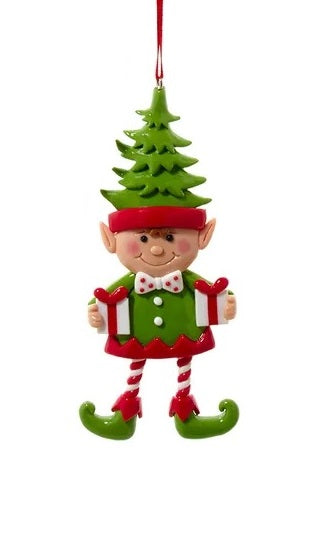 Elf ornament. There are three options. One elf is wearing a white and red polka dot jumper and ice skates. One elf is wearing a hat shaped like a tree and is holding two gifts. One elf is wearing a green jumper and wearing ice skates.