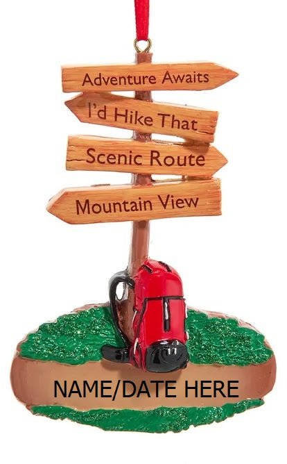 Christmas ornament shaped like a hiking trail sign. Signs read "Adventure Awaits," "I'd Hike That," Scenic Route" and "Mountain View."
