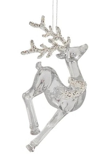 Transparent ornaments shaped like deer and covered in silver glitter.