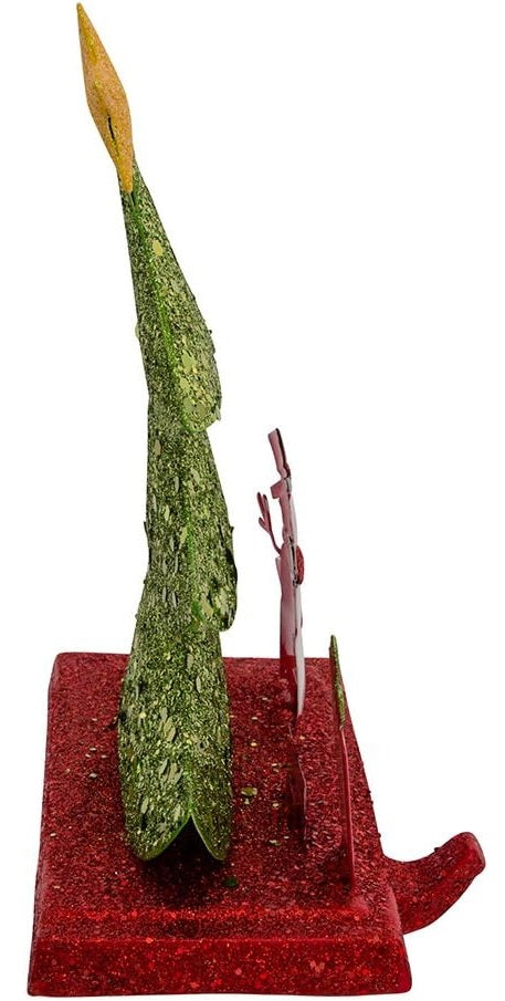 Stocking hanger covered in glitter. Designed to look like a light green tree with a yellow star on top. Next to the tree are two presents and a snowman wearing a top hat and a red scarf. The base of the holder is covered in red glitter.