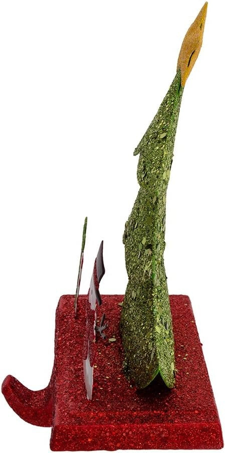 Stocking hanger covered in glitter. Designed to look like a light green tree with a yellow star on top. Next to the tree are two presents and a snowman wearing a top hat and a red scarf. The base of the holder is covered in red glitter.