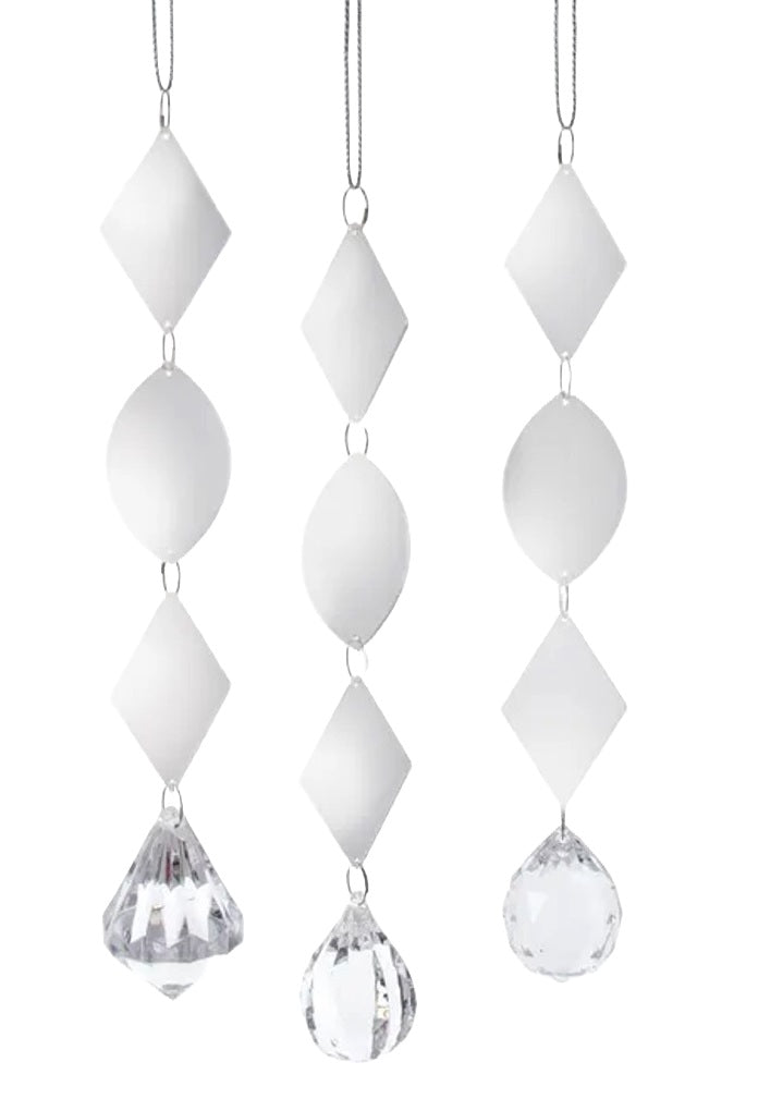 Dangling ornaments in silver and white.