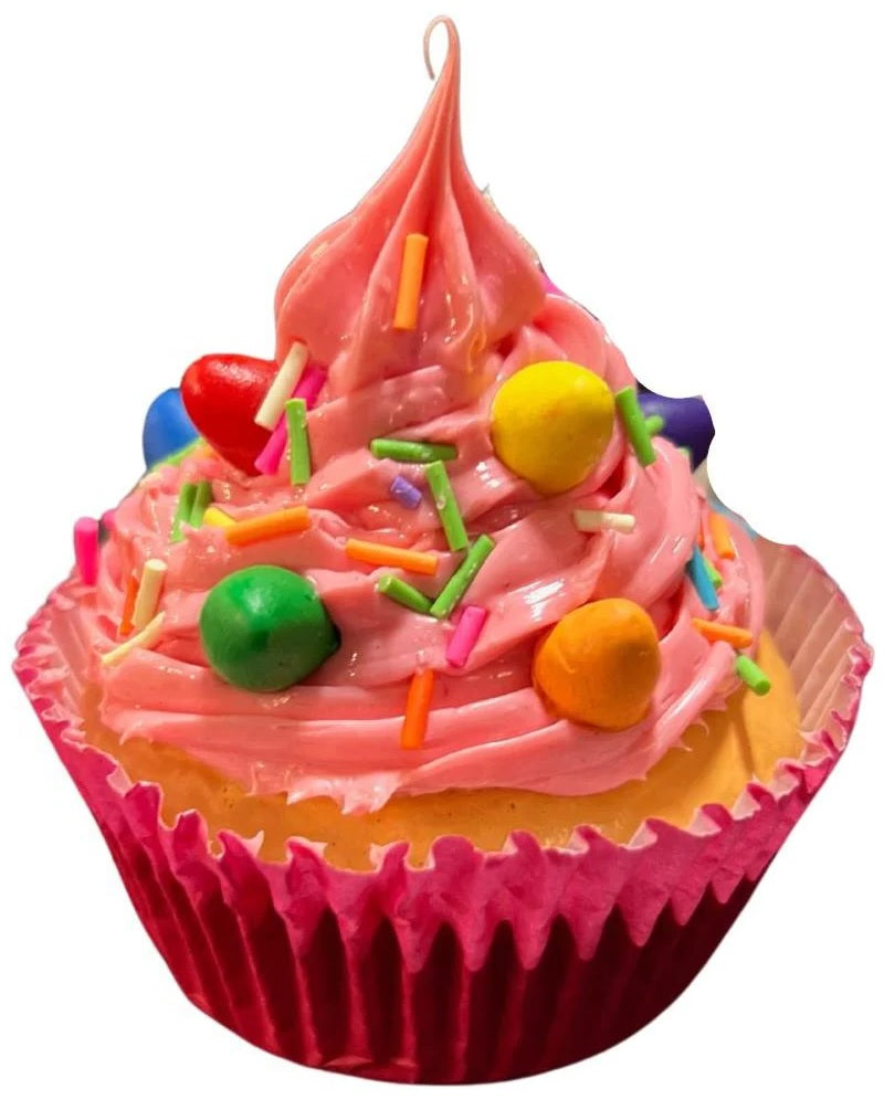 Christmas ornaments shaped like cupcakes with different colored frosting and candies on them.