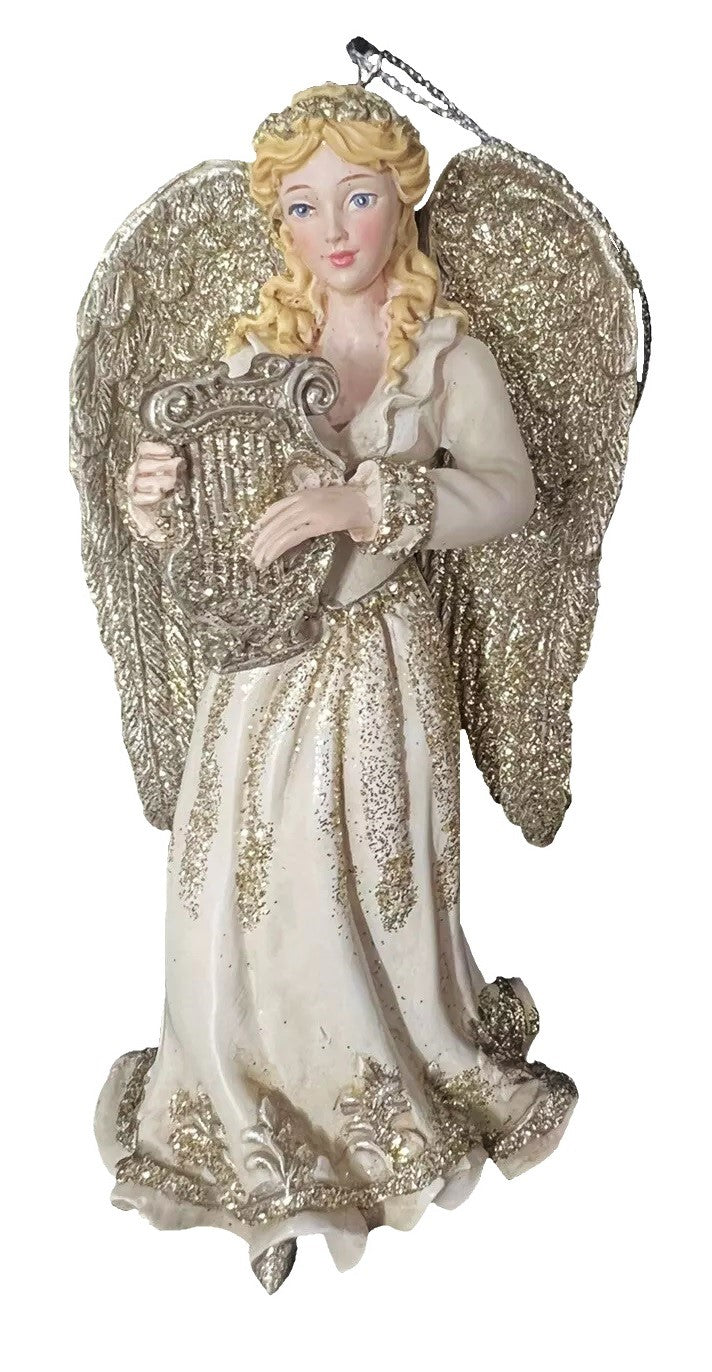 Ornament shaped like an angel holding a musical instrument. One angel is blond and holding a harp. One angel is brunette and holding a trumpet. One angel is a redhead and holding a mandolin.