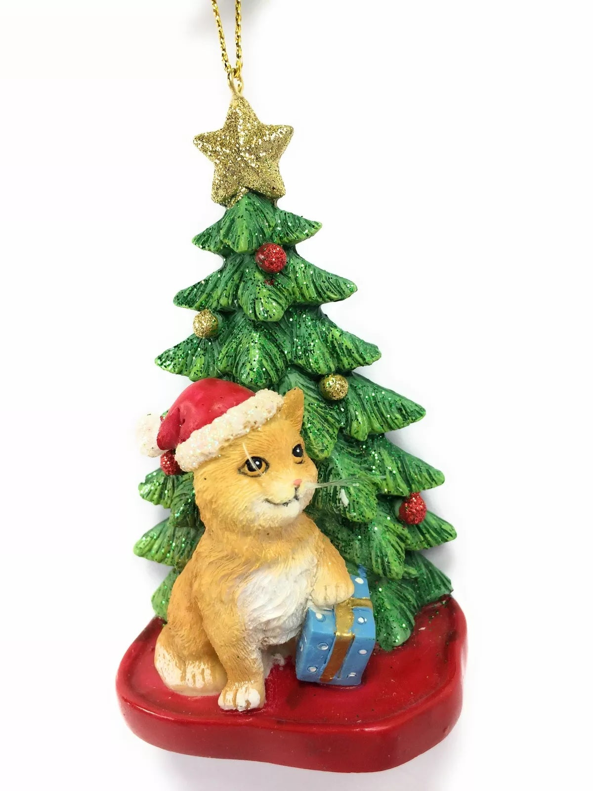Ornaments shaped like a cat in front of a tree. One ornament features a black and white cat. One ornament features an orange and white cat. One ornament features a light gray and dark gray cat. One ornament features a white cat. All the cats are wearing Santa hats.