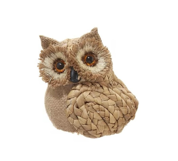 Ornament shaped like an owl with big, brown eyes.