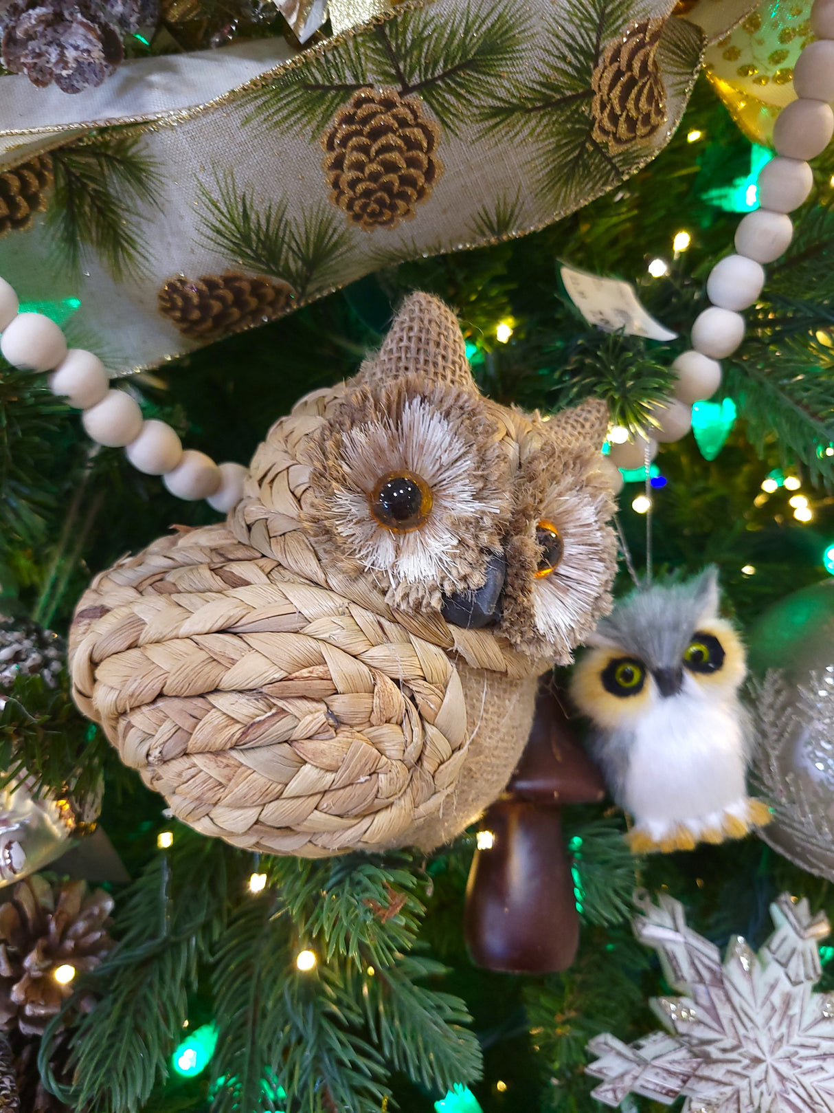 Ornament shaped like an owl with big, brown eyes.