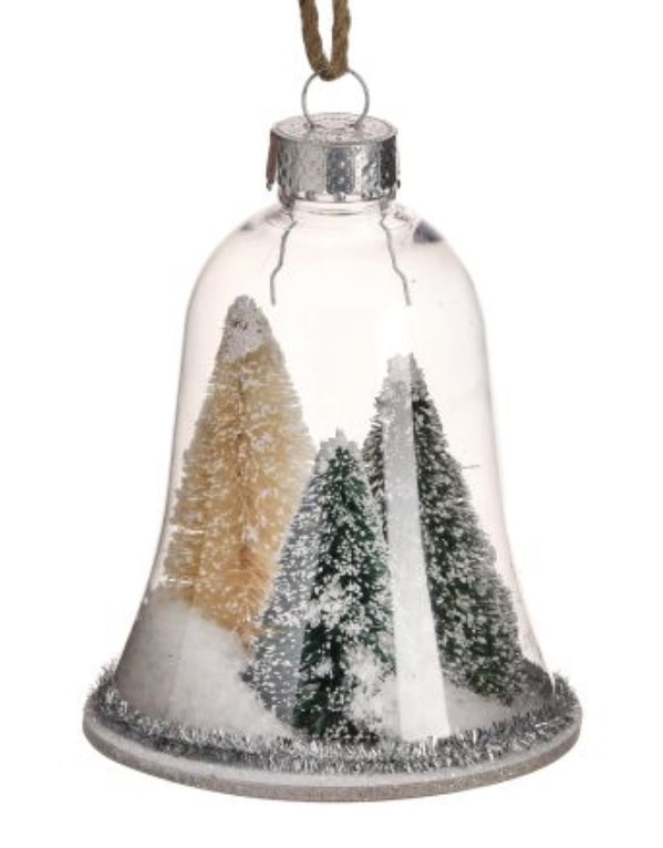Ornament shaped like a glass bell with small bottle brush trees inside. One ornament features two green trees and one yellow tree. One ornament features two reddish brown trees and one yellow tree. All the trees are designed to appear covered in snow. Each ornament features tinsel around the border.
