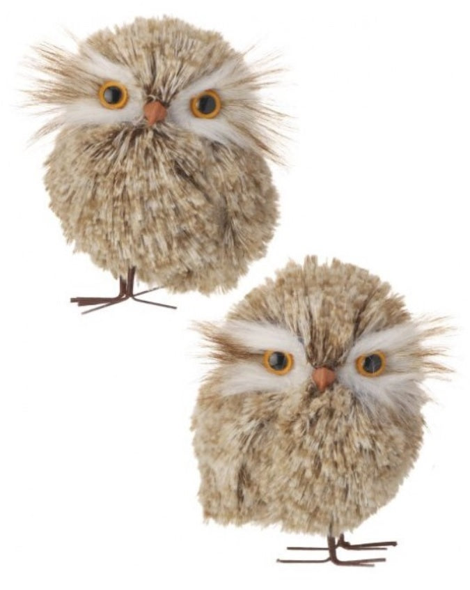 Fluffy ornament shaped like a cute owl with big, yellow/orange eyes.