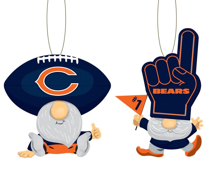 Officially licensed Chicago Bears ornament shaped like a gnome. There are two options. One gnome is wearing a blue Bears football as a hat and giving a thumbs up. One gnome is wearing a blue Bears foam finger as a hat and is waving a flag.