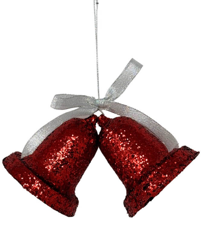 Ornament consisting of two red, glittered bells hanging from a gray string.
