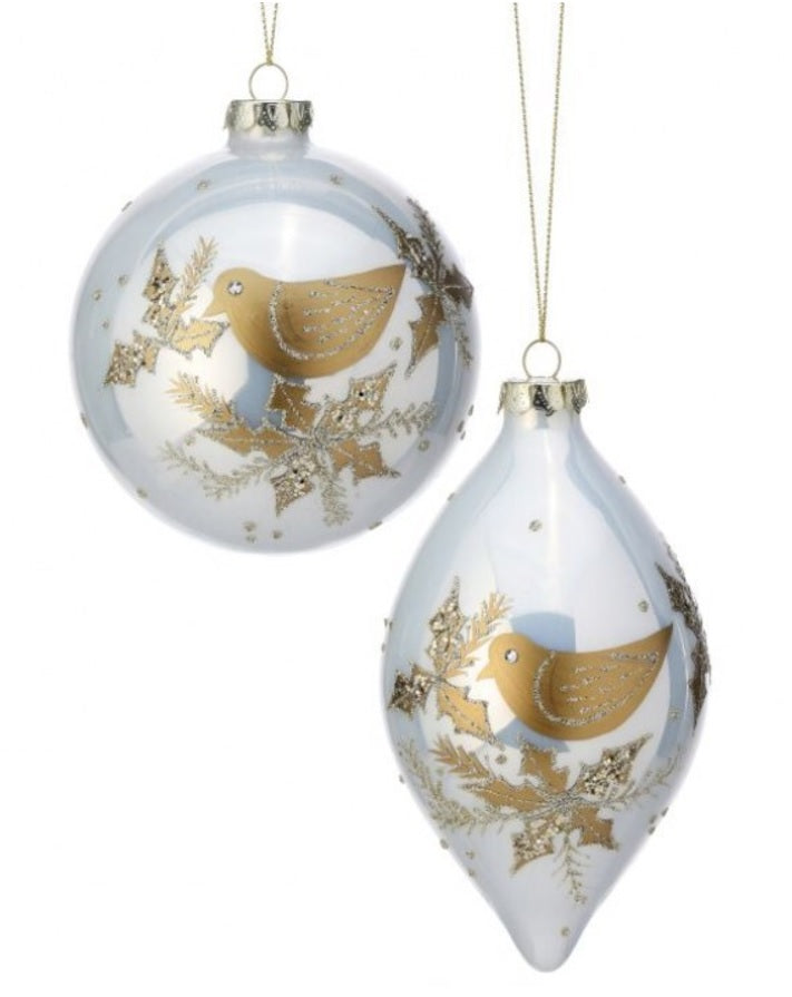 Made of glass, glitter and gemstones. One ornament is bauble shaped. One ornament is finial shaped. Both ornaments feature a gold dove with gold holly leaves.