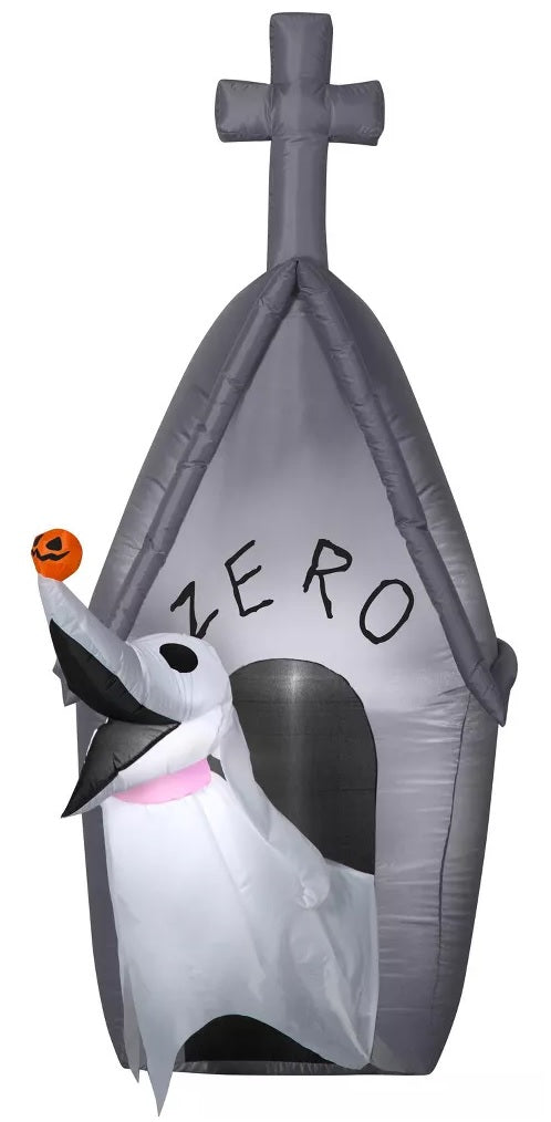 Halloween inflatable shaped like the character Zero from The Nightmare Before Christmas, emerging out of his doghouse. Zero has a tiny, carved pumpkin on his nose.