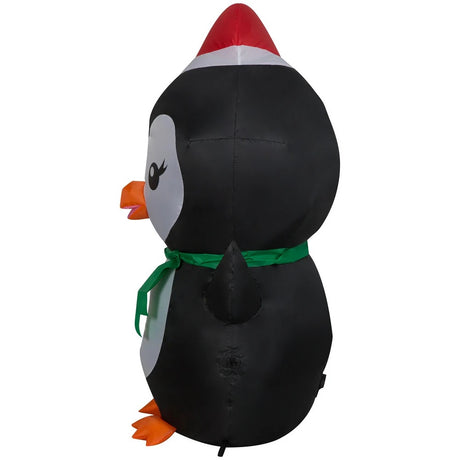Christmas inflatable designed to look like a cute penguin wearing a Santa hat and a green scarf.