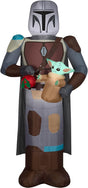 Christmas inflatable designed to look like the Star Wars characters The Mandalorian and Grogu. Mando is holding Grogu and a red holiday ornament.