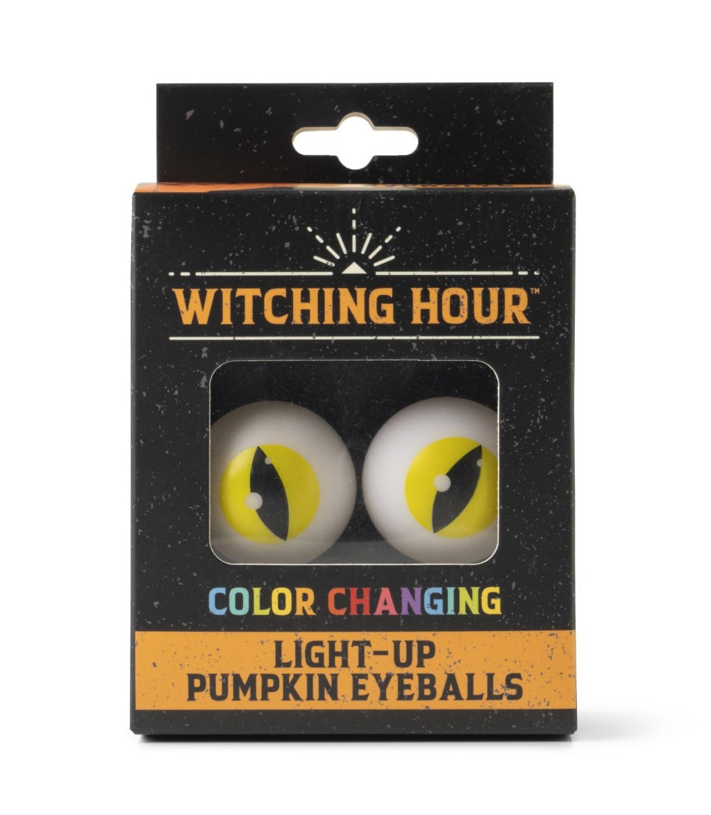 This image shows the cat eyeballs inside their packaging. The packaging reads "Witching Hour. Color Changing Light Up Pumpkin Eyeballs."
