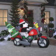 Christmas inflatable. It features Snoopy wearing a Santa hat and wearing sunglasses. Snoopy is driving a red motorcycle with a snowflake accent on it. There's a decorated Christmas tree on the back and Woodstock is riding on the handlebars. There are LED lights inside.