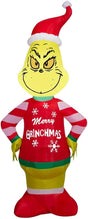 Christmas inflatable shaped like the cartoon character The Grinch. The Grinch is wearing a Santa hat and an "ugly" sweater that reads "Merry Grinchmas." The sleeves on the sweater are red and white striped.
