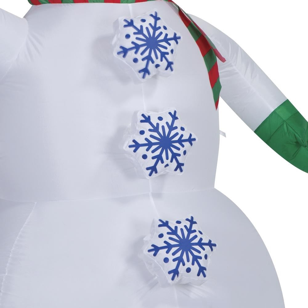 Inflatable snowman wearing a top hat, a red and green striped scarf and green gloves. There are buttons shaped like snowflakes going down his belly. The buttons spin!