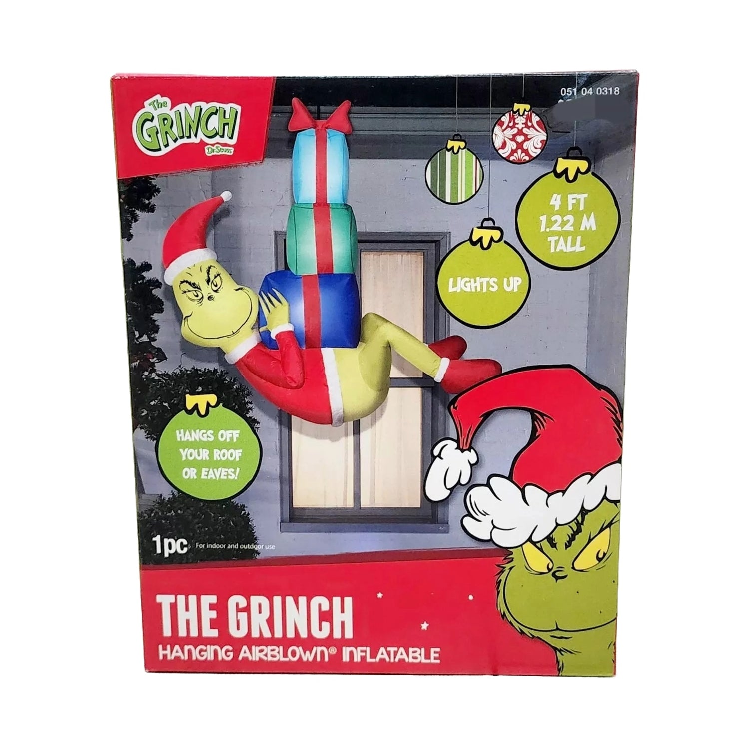 Christmas inflatable designed to look like The Grinch dressed as Santa and hanging from a rope, holding presents.