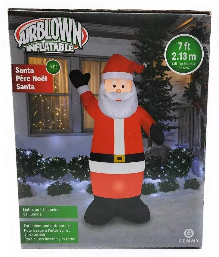 Christmas inflatable shaped like Santa Claus, wearing his traditional red suit and hat. Santa is waving.
