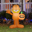 Halloween inflatable shaped like Garfield the cat. He's holding a jack-o-lantern.