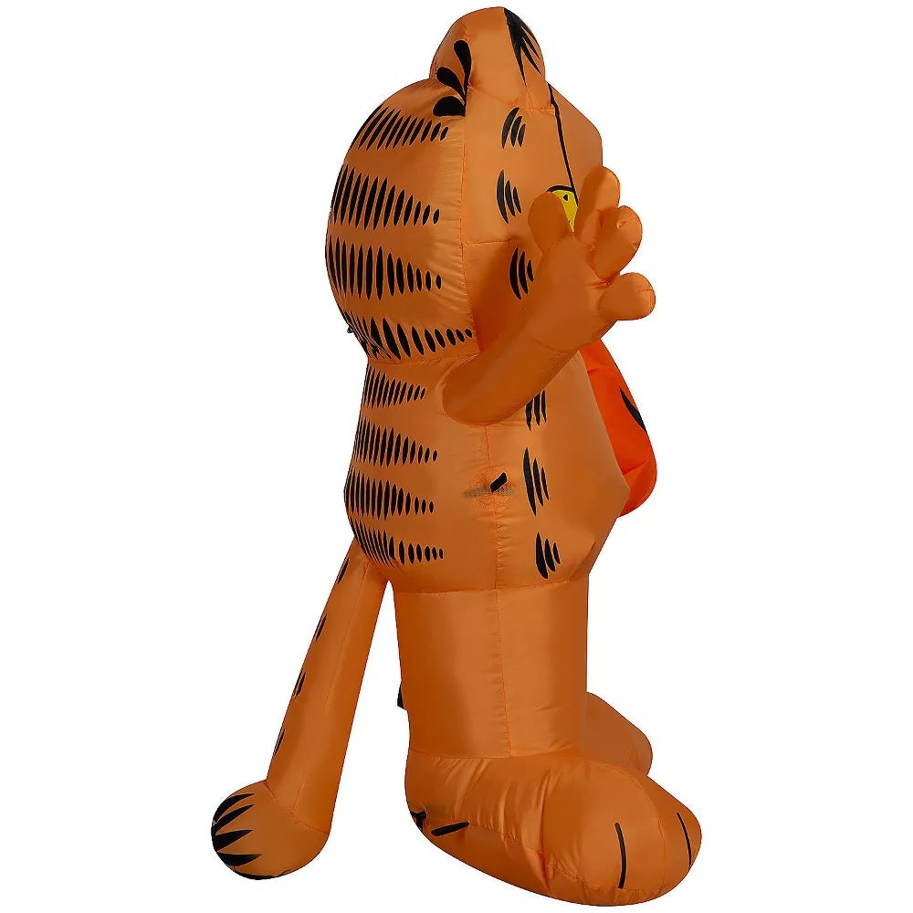 Halloween inflatable shaped like Garfield the cat. He's holding a jack-o-lantern.