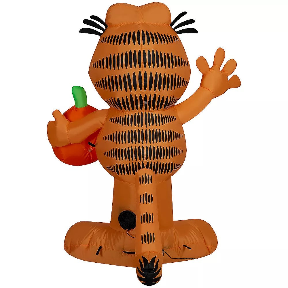 Halloween inflatable shaped like Garfield the cat. He's holding a jack-o-lantern.