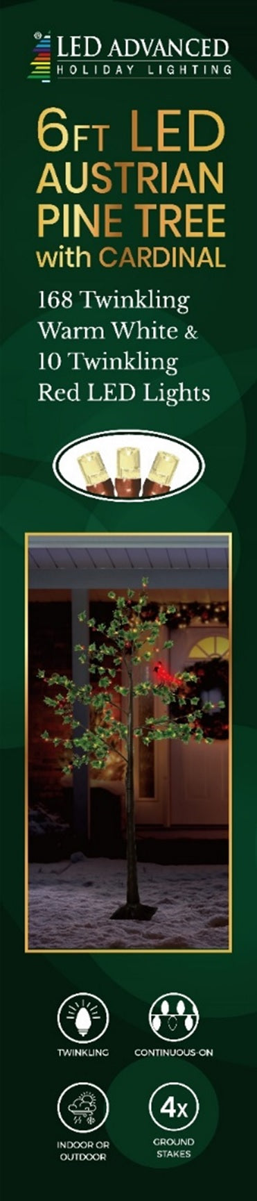 Pre-lit fake Christmas pine tree. Lights are warm white and red and the leaves are green. There's also a lit cardinal attached to one of the branches.